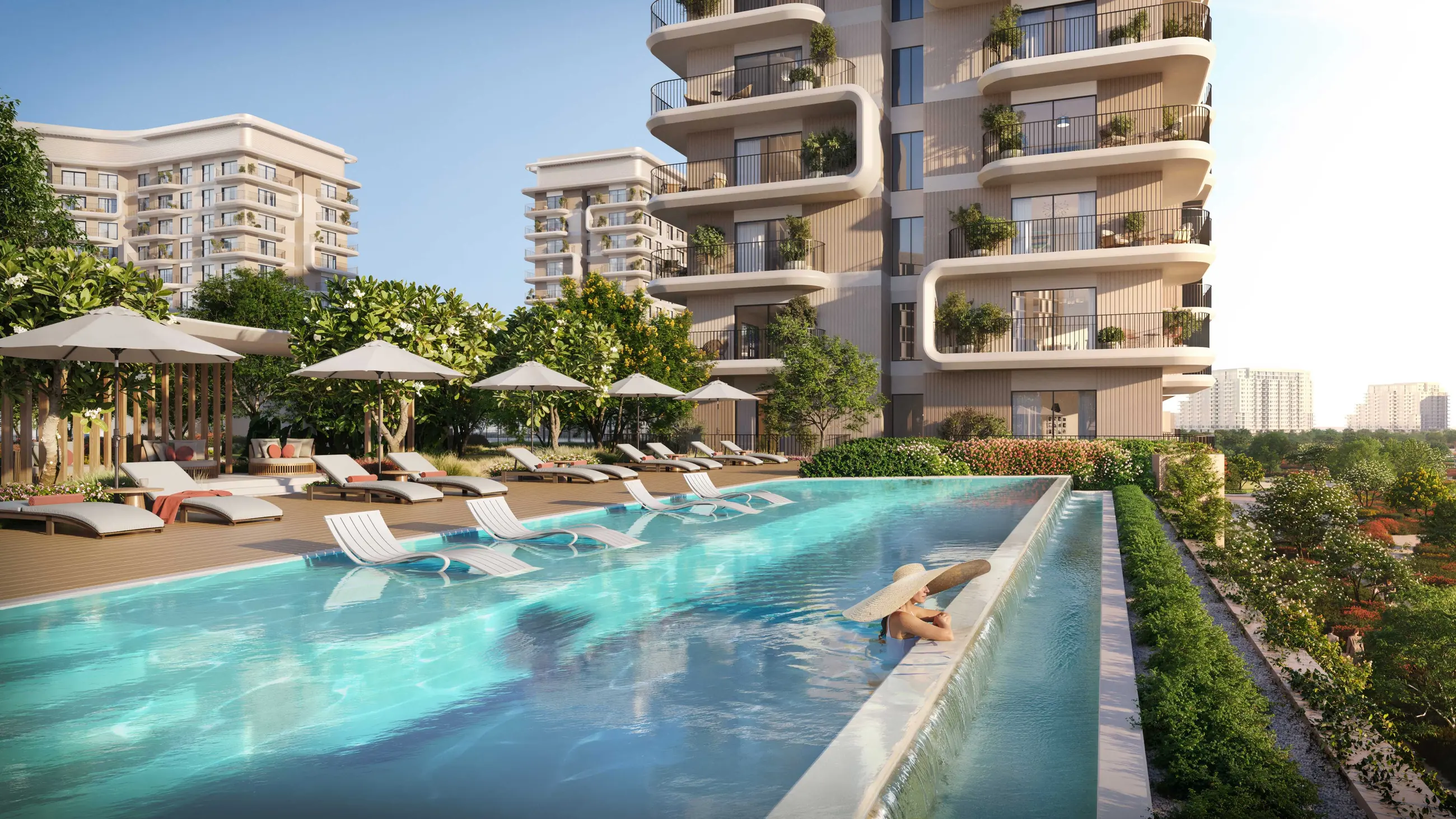 The adults-only infinity pool at Yas Park Place, framed by the mid-rise residences at dusk