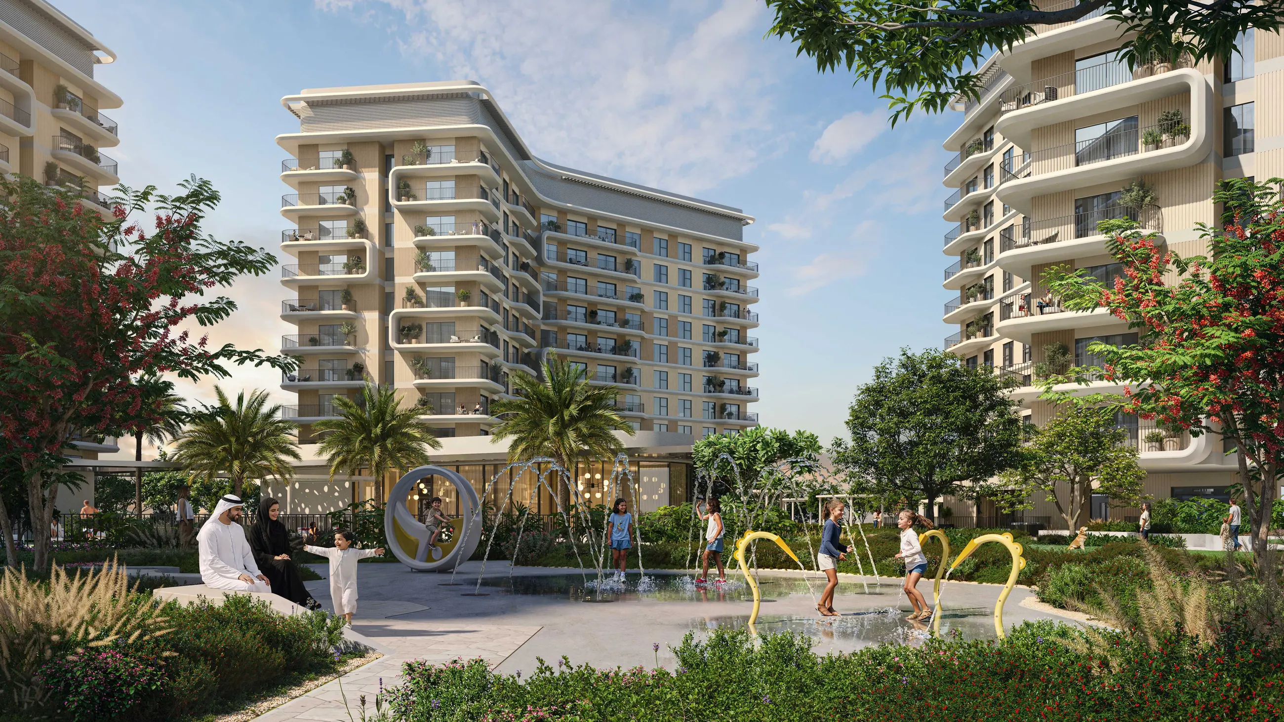 Children playing at the splash pad along the garden path at Yas Park Place, mid-rise residences behind